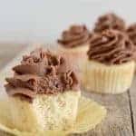white cupcakes with chocolate frosting