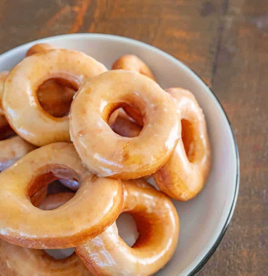 Beth's Famous Glazed Yeast Donuts are light, fluffy, easy to make, and done in just a few hours with a rich and creamy glaze to go on top.