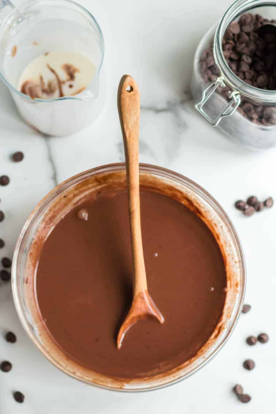 Glass bowl with melted chocolate. 