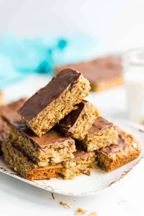 Chocolate Peanut Butter Oatmeal Cookie Bars stacked on a platter and ready to be eaten.