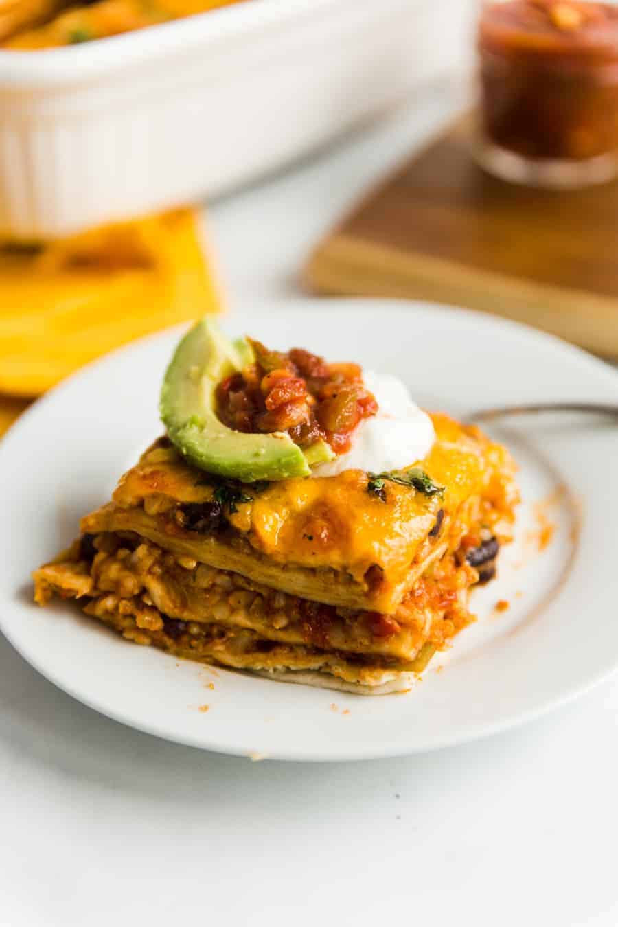 This easy, meatless meal is like a rice-and-bean-layered enchilada casserole. Topped with green or red enchilada sauce (you pick!) and cheese, you'll be satisfied with this savory rendition of a classic Tex-Mex dish.