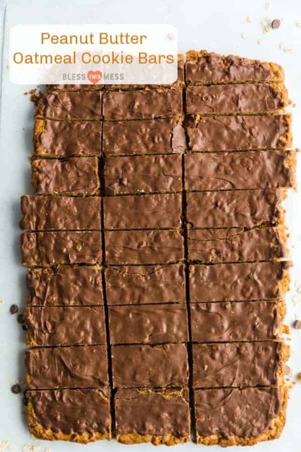 A pan of chocolate topped peanut butter oatmeal cookie bars cut into rectangular servings