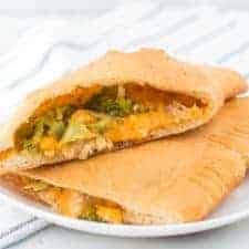 Cheesy chicken and broccoli calzones are gooey bites of pizza-reminiscent goodness that are easy to make and enjoy!