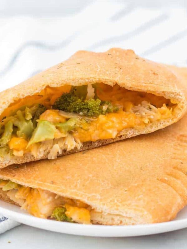 Cheesy chicken and broccoli calzones are gooey bites of pizza-reminiscent goodness that are easy to make and enjoy!