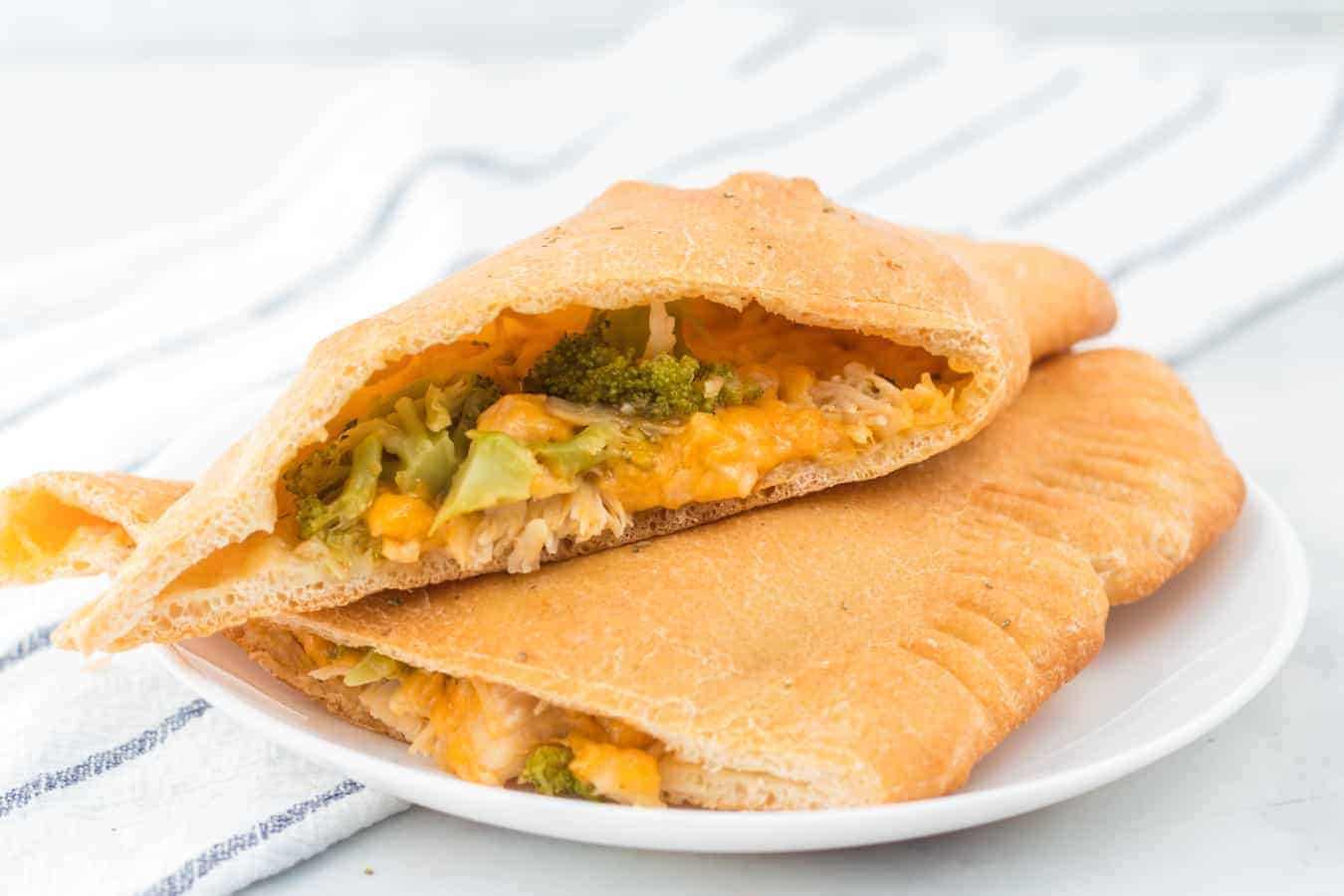 Cheesy chicken and broccoli calzones are gooey bites of pizza-reminiscent goodness that are easy to make and enjoy!