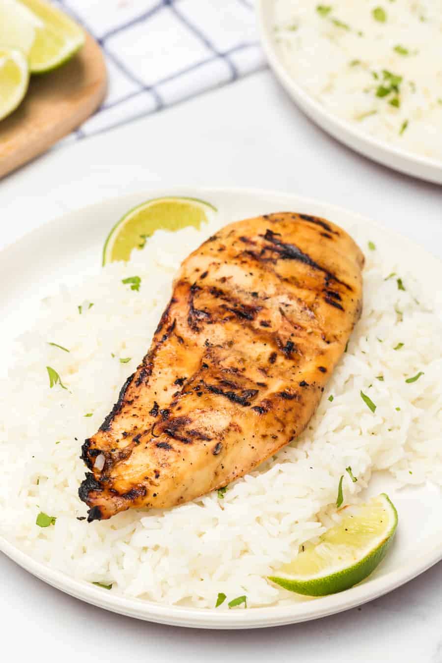 Grilled honey lime chicken breast is bright, sweet, and smoky, and is just as delicious on its own as a main dish as it is on top of salads, tacos, or anything else!