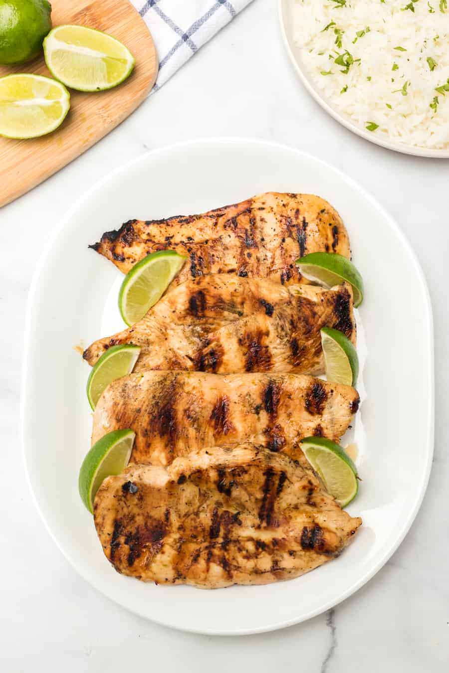 Grilled honey lime chicken breast is bright, sweet, and smoky, and is just as delicious on its own as a main dish as it is on top of salads, tacos, or anything else!