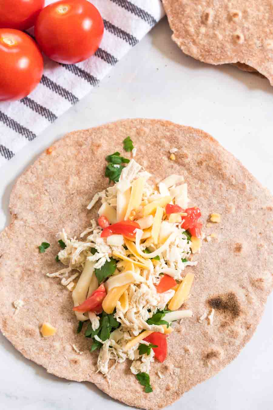 Hearty and healthy, whole wheat tortillas are beyond simple to make and go great with bold flavored wraps, tacos, and gyros!