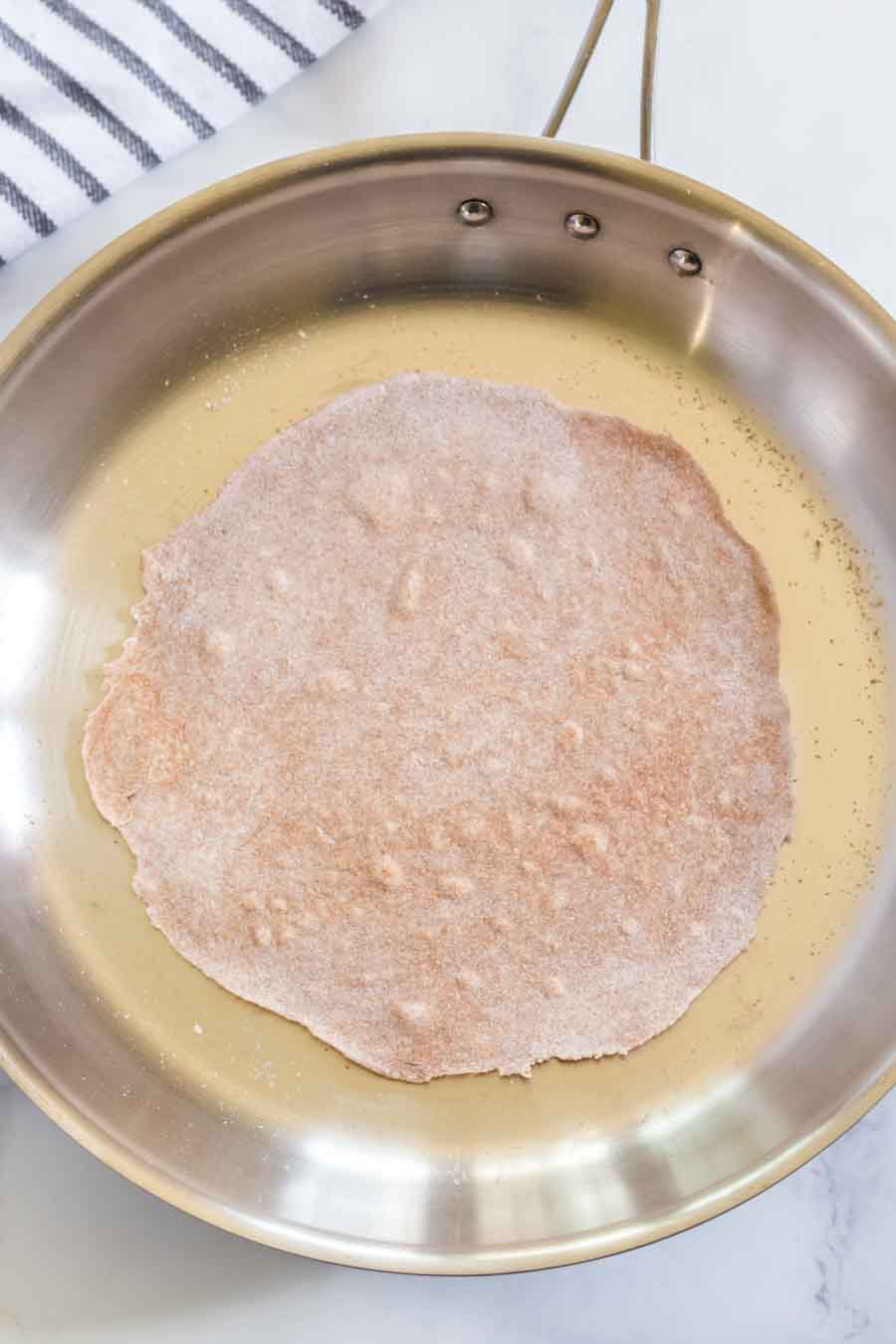 Hearty and healthy, whole wheat tortillas are beyond simple to make and go great with bold flavored wraps, tacos, and gyros!