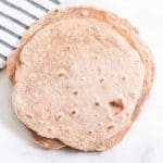 Hearty and healthy, whole wheat tortillas are beyond simple to make and go great with bold flavored wraps, tacos, and gyros!