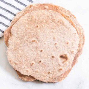Hearty and healthy, whole wheat tortillas are beyond simple to make and go great with bold flavored wraps, tacos, and gyros!