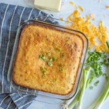 top view of the baking dish of cornbread with cheese and scallions