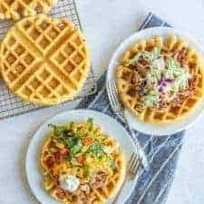 savory cornbread waffles on a white plate overhead view