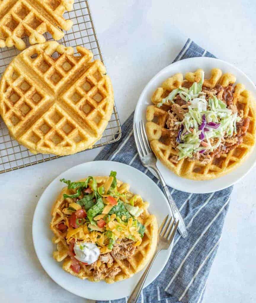 savory cornbread waffles on a white plate overhead view