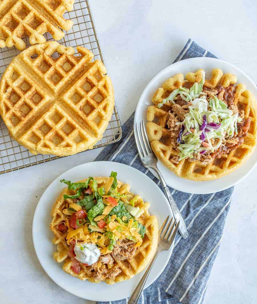 savory cornbread waffles on a white plate overhead view