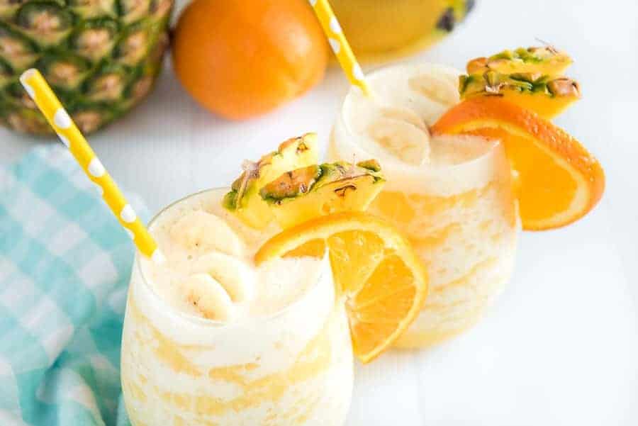 You can't go wrong with the refreshing and tropical flavors of this orange pineapple banana smoothie! #smoothie #fruitsmoothie #tropicalsmoothie #orange #pineapple #banana