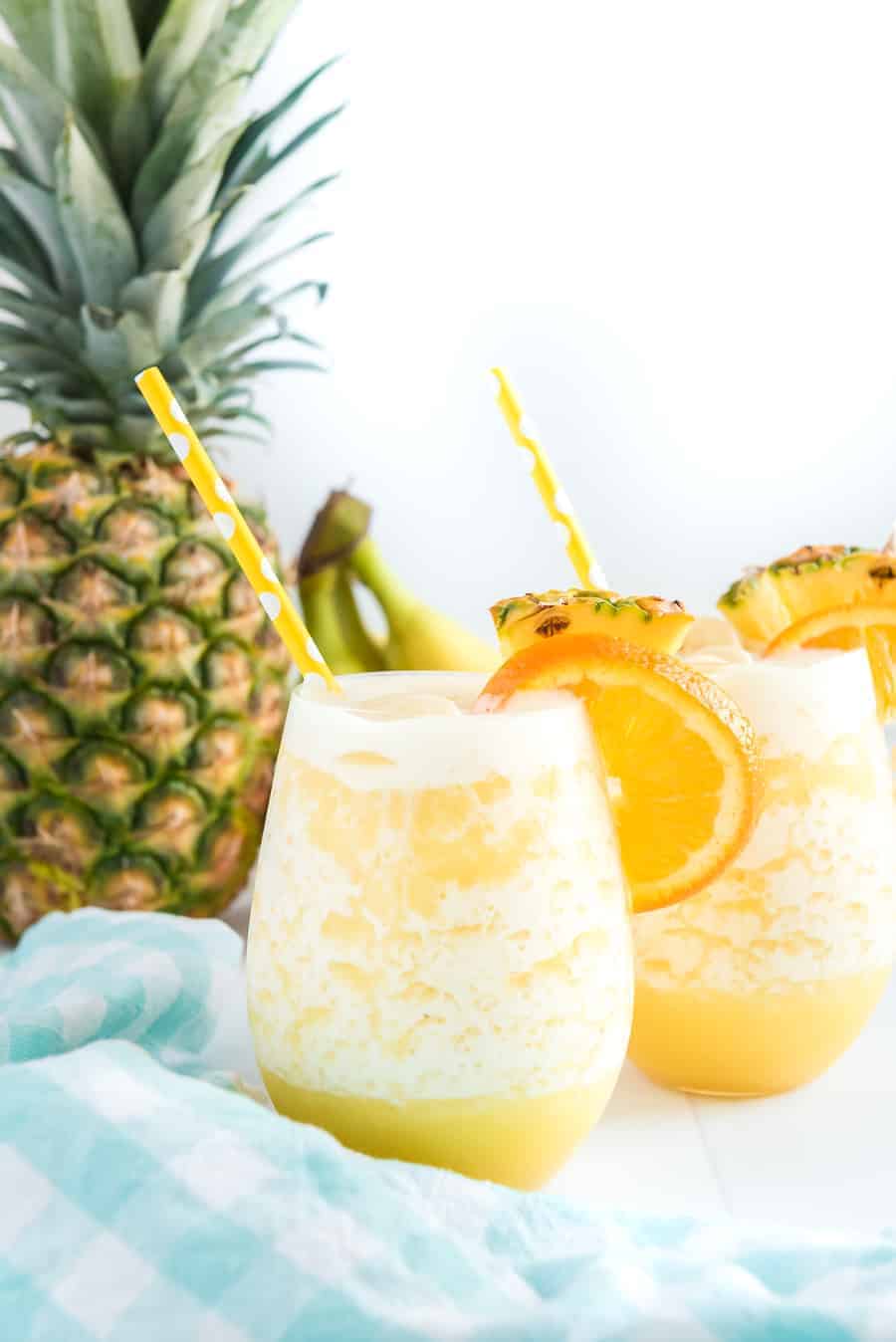 You can't go wrong with the refreshing and tropical flavors of this orange pineapple banana smoothie! #smoothie #fruitsmoothie #tropicalsmoothie #orange #pineapple #banana