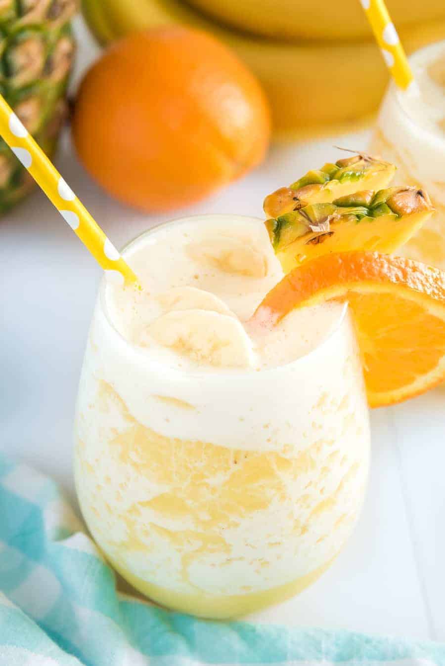 You can't go wrong with the refreshing and tropical flavors of this orange pineapple banana smoothie! #smoothie #fruitsmoothie #tropicalsmoothie #orange #pineapple #banana