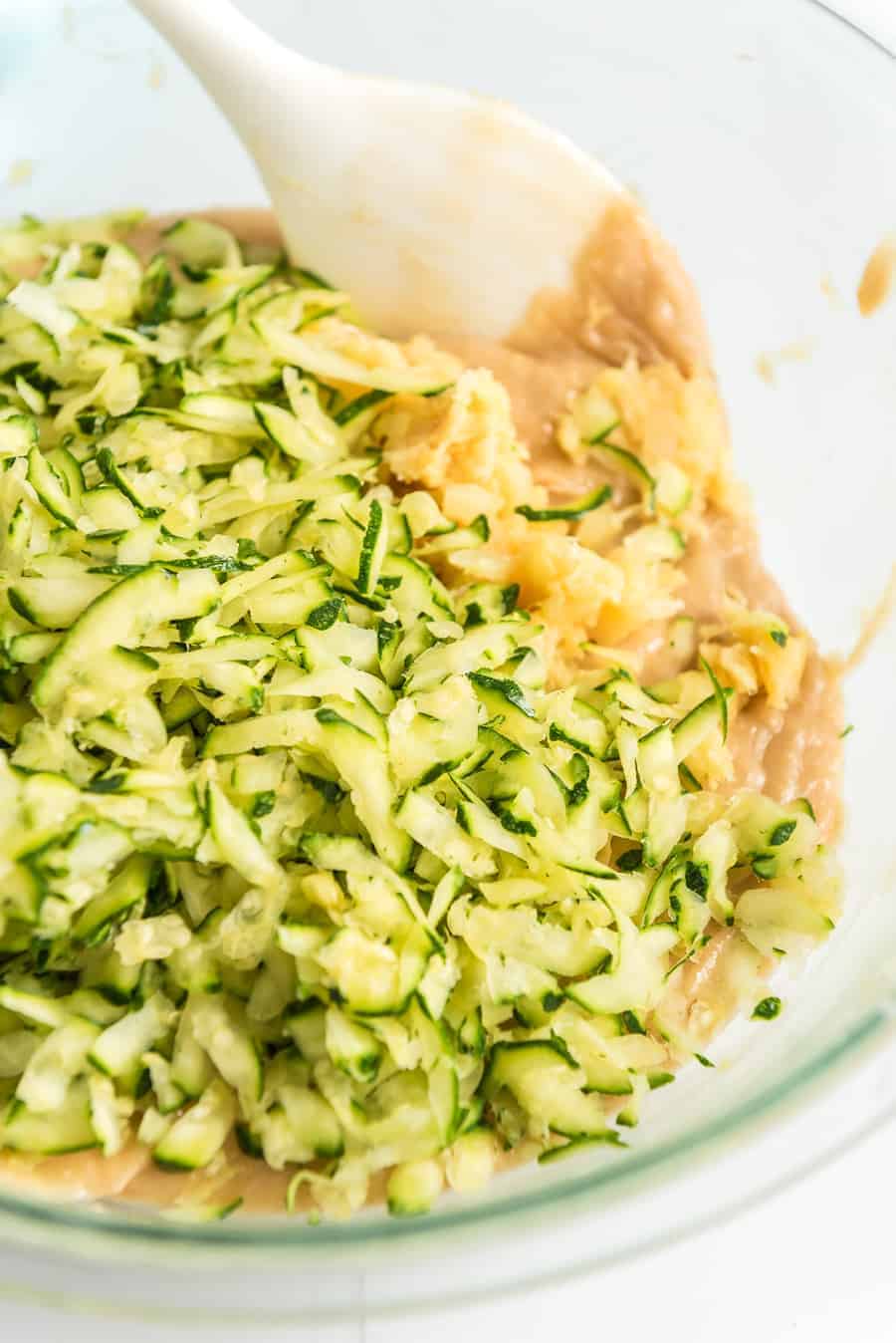 zucchini bread ingredients being mixed