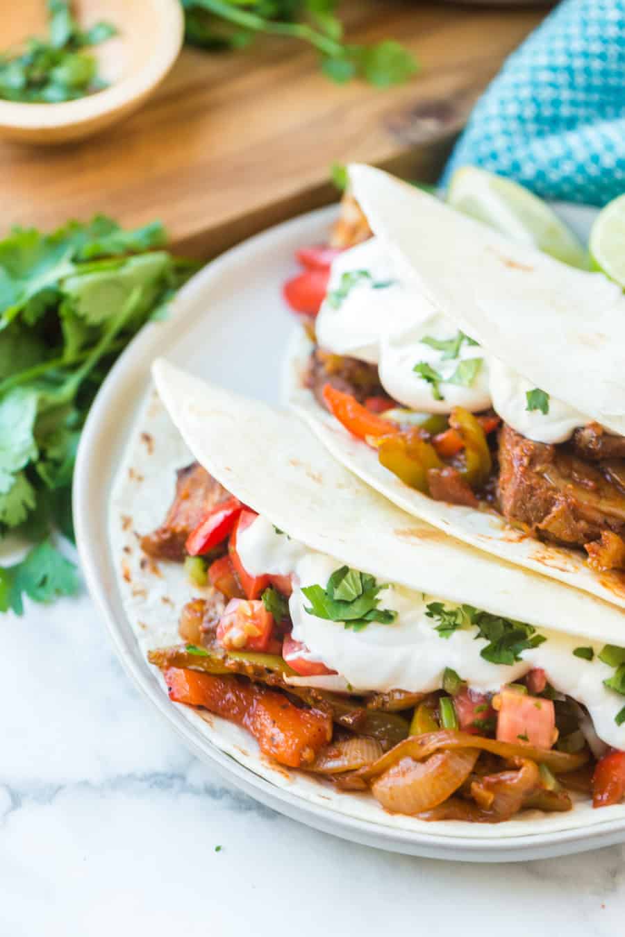 Easy steak fajitas come together fast with simple, fresh ingredients, including onion, peppers, salsa, pre-grilled steaks, and smoky, savory seasonings. #fajitas #steak #steakfajitas #texmex #mexicanfood #grilledsteak