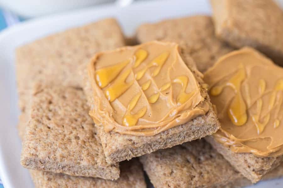 simple homemade graham cracker squares covered in peanut butter and honey