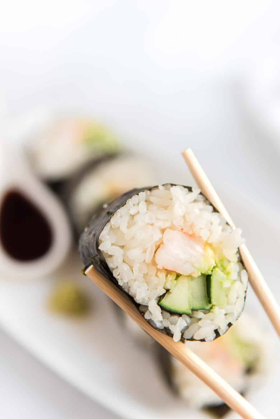 shrimp sushi with chopsticks