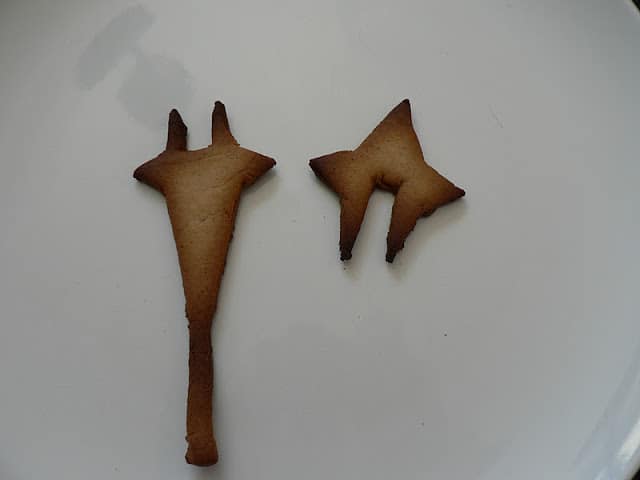 Baked gingerbread star pieces with notches to fit together