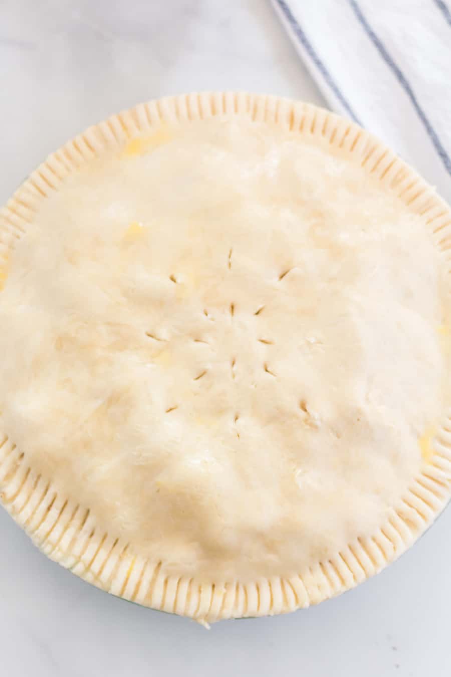 This Perfect Pie Crust (made with shortening and butter) comes together with just a few ingredients, one of which may just surprise you: vinegar.