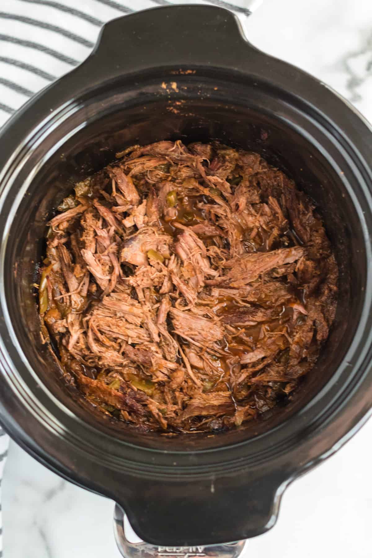 Smoky and hearty Steak Carnitas Meat in the Crock-Pot is one of the best set-it-and-forget-it meals that's exquisitely flavored and makes some tender and rich tacos.