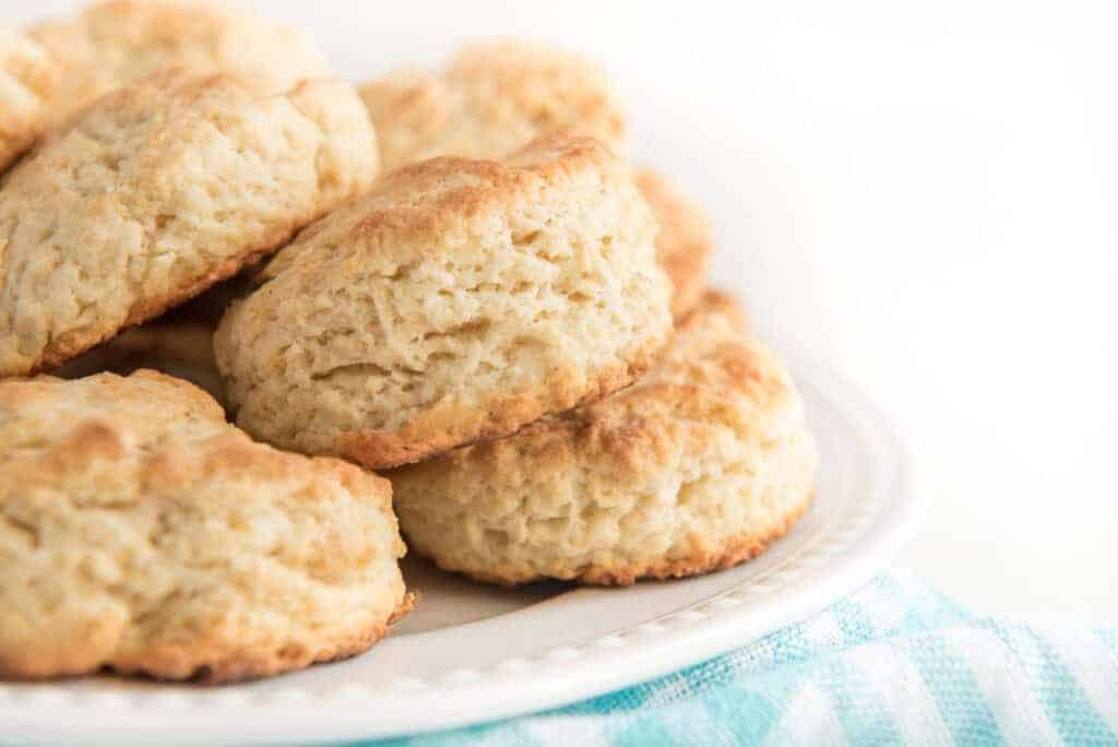 stack of butter biscuits on a white plate