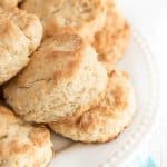 stack of butter biscuits on a white plate