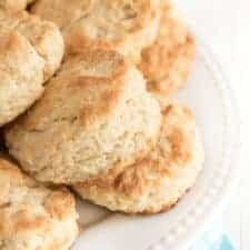 stack of butter biscuits on a white plate