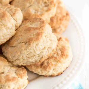 stack of butter biscuits on a white plate