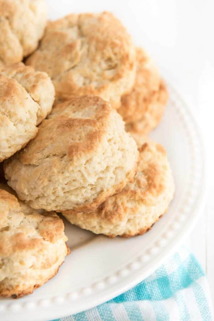 stack of butter biscuits on a white plate