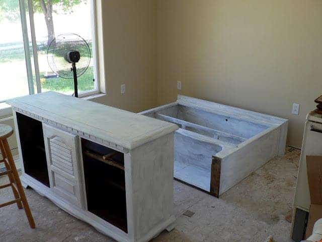 top and bottom portions of furniture hutch with white prime for paint.