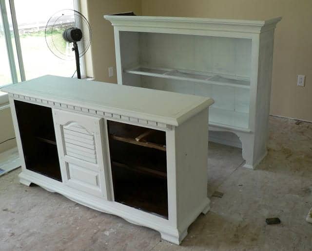 top and bottom portions of furniture hutch with white prime for paint.