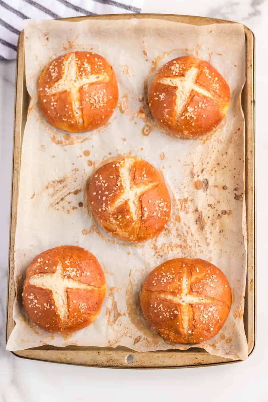 Homemade Pretzel Rolls made with a simple yeast dough that is kneaded until soft, boiled, and then baked into soft and extra chewy pretzel rolls.