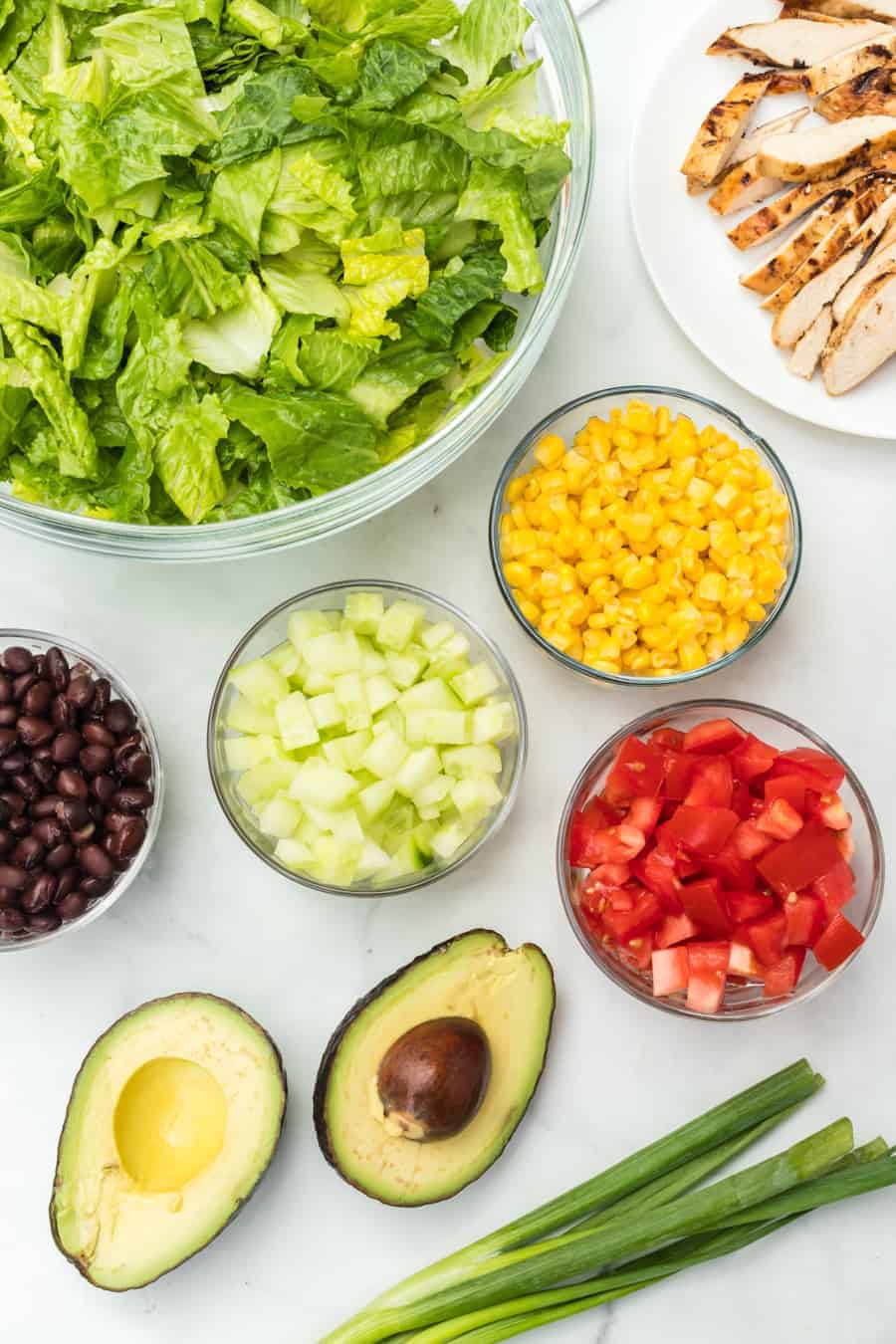 Barbecue ranch chicken salad is the most flavorful salad you'll ever eat, complete with a smoky and sweet dressing, grilled chicken, avocado, tomato, corn, romaine, and a whole lot of other vibrant veggies.