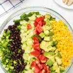 chicken ranch salad ingredients in a glass bowl