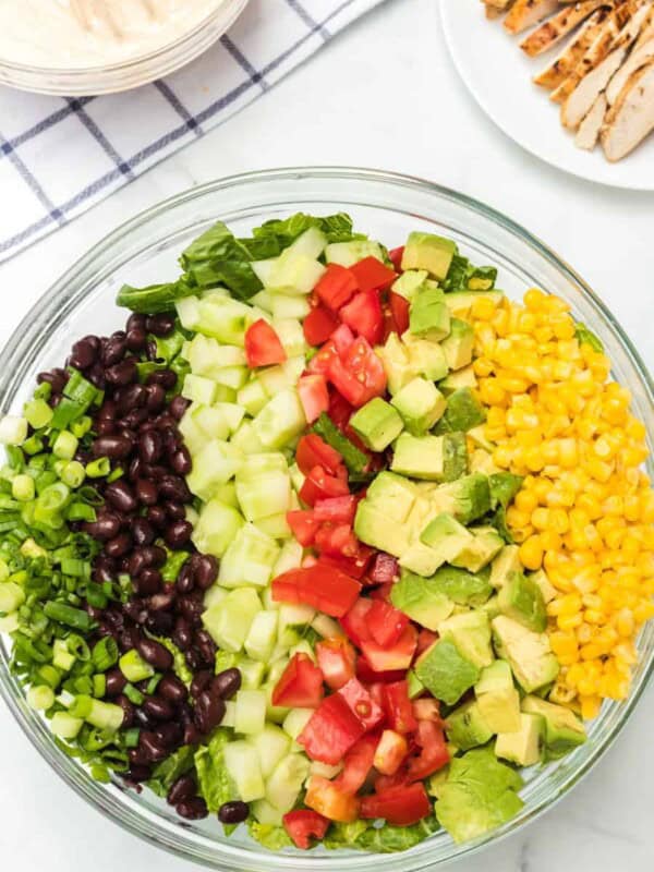 chicken ranch salad ingredients in a glass bowl