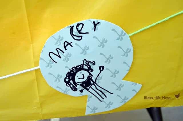 A close-up of a child-crafted fish garland decoration