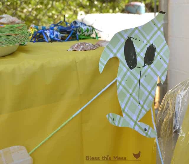 A close-up of a child-made fish garland decoration