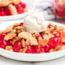 Sweet and tart with the perfect buttery, crumbly topping, homemade cherry crumble is an absolute game changer when it comes to festive and fun summertime dessert.