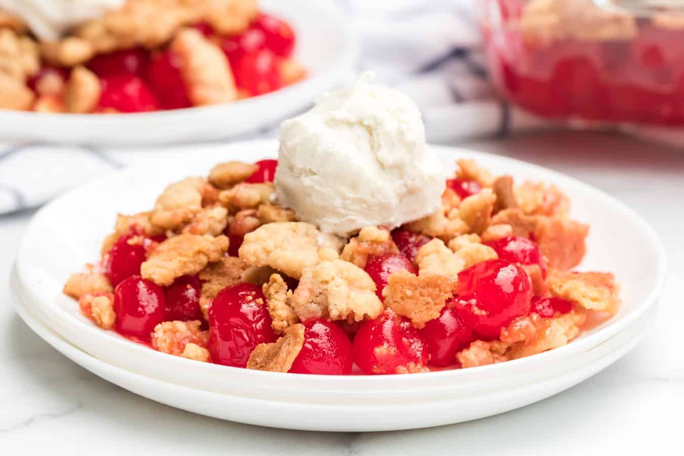 Sweet and tart with the perfect buttery, crumbly topping, homemade cherry crumble is an absolute game changer when it comes to festive and fun summertime dessert.