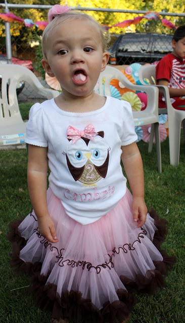 Little girl with owl-themed outfit