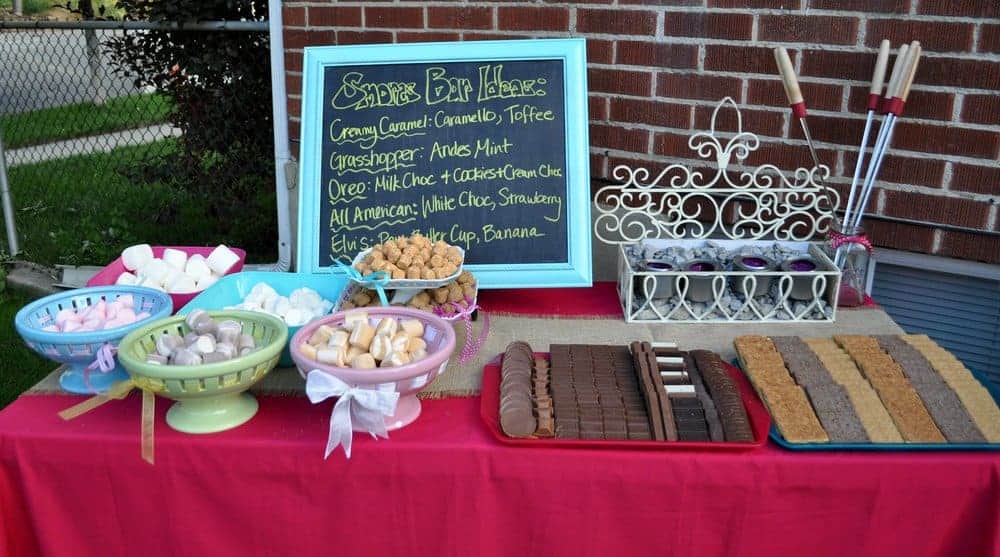 A table with ingredients and menu for DIY Smores Bar