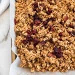 Cinnamon Granola is a simple snack that's bursting with mildly sweet and crunchy goodness, thanks to the oats, honey, shredded coconut, dried cranberries, cinnamon, vanilla, and nuts.