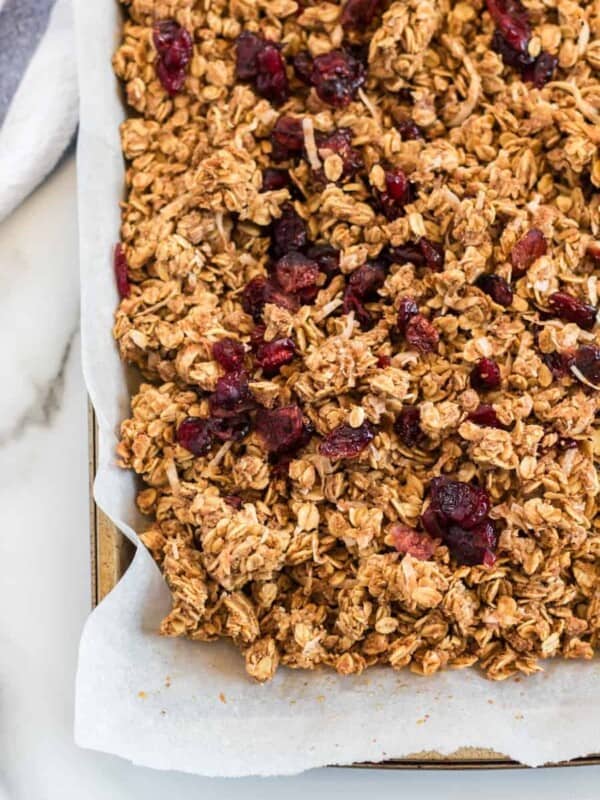 Cinnamon Granola is a simple snack that's bursting with mildly sweet and crunchy goodness, thanks to the oats, honey, shredded coconut, dried cranberries, cinnamon, vanilla, and nuts.