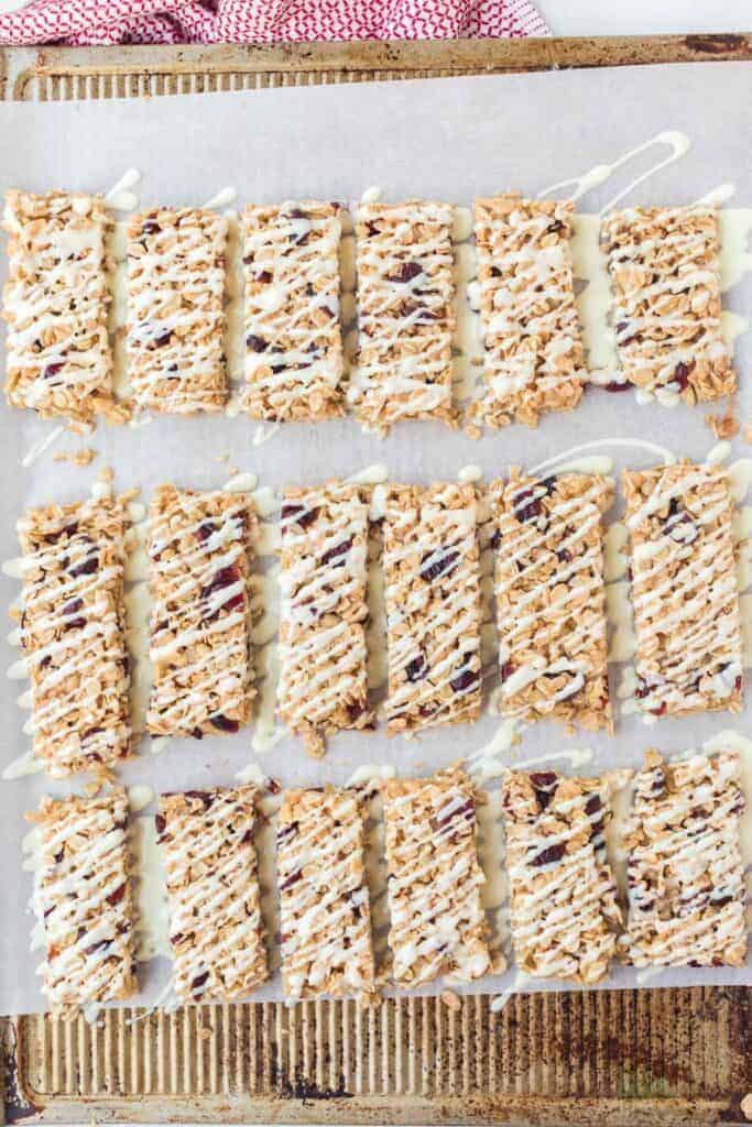 rectangles of cranberry granola bars on parchment