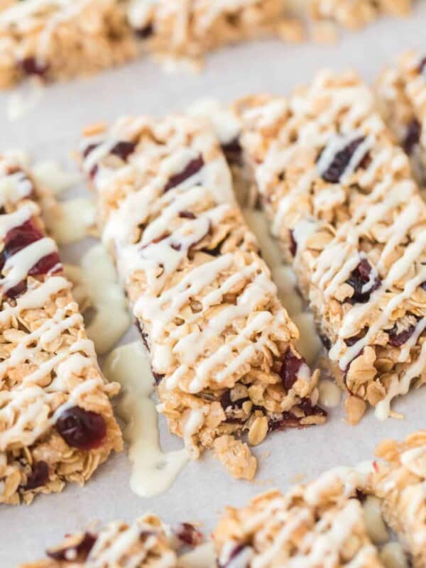 rectangles of cranberry granola bars on parchment
